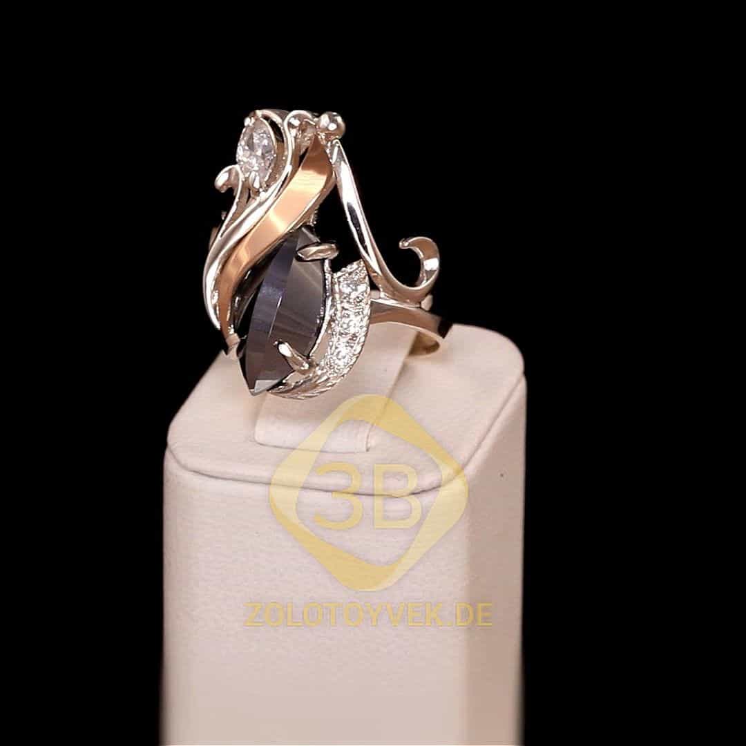 Серебряное кольцо со вставками золота, им. гематитом и фианитами