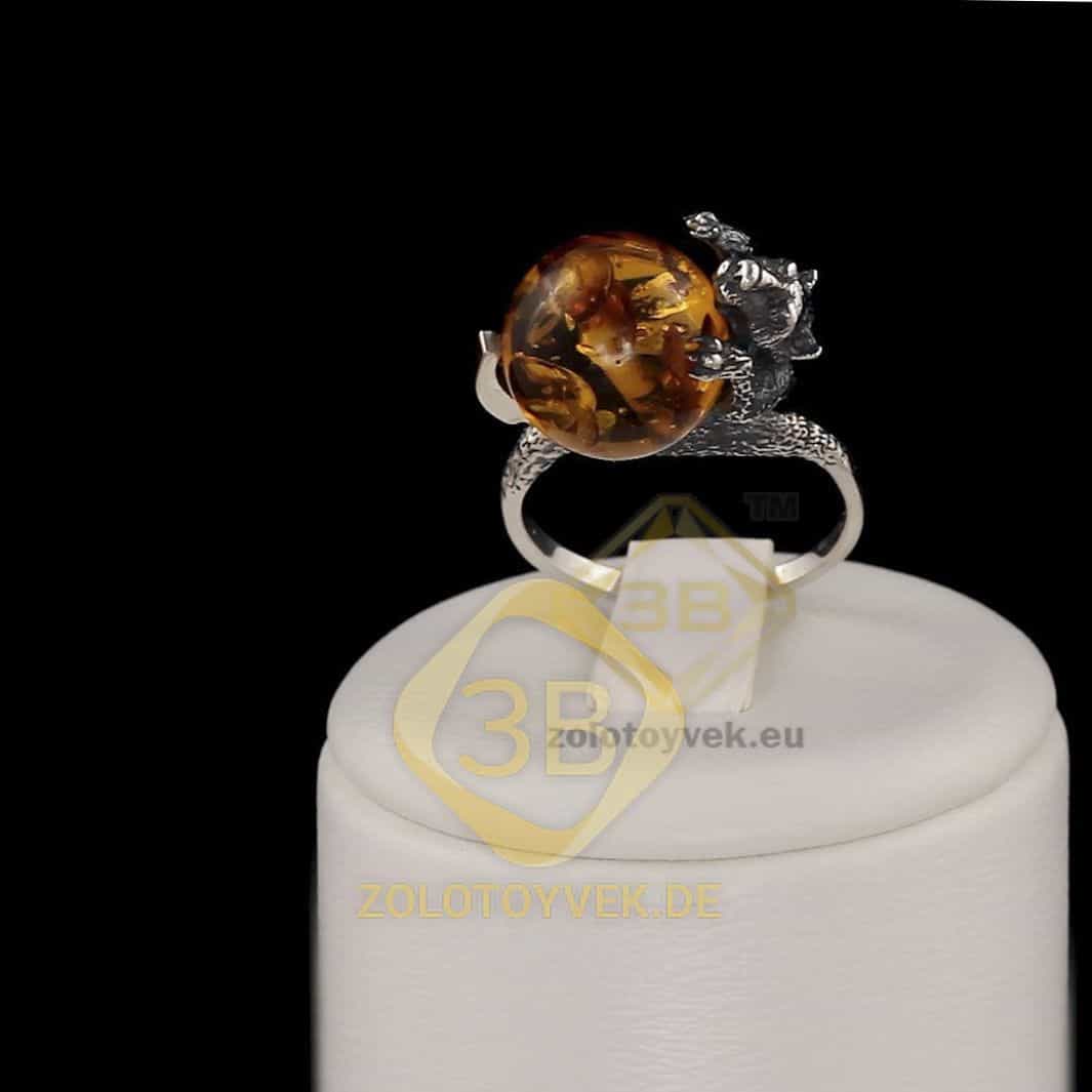 Серебряное кольцо со вставками золота и им. янтаря, покрытие Родий