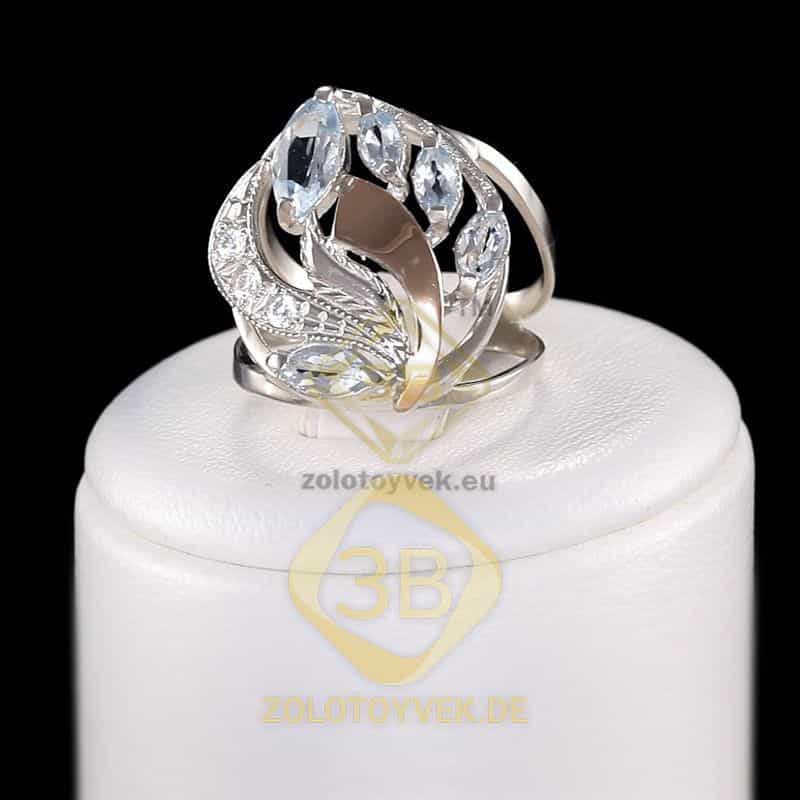 Серебряное кольцо со вставками золота, топазом и фианитами, покрытие Родий