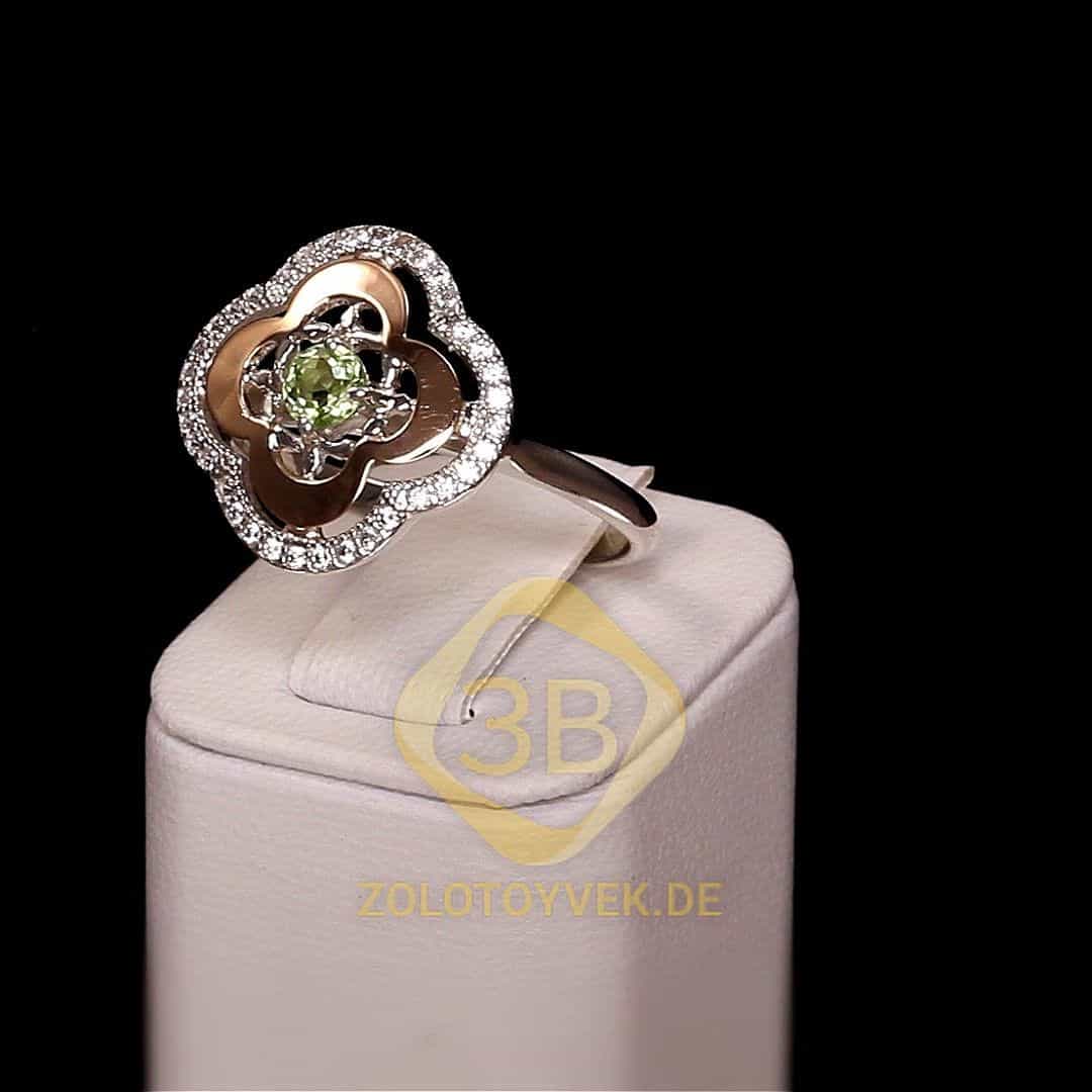 Серебряное кольцо со вставками золота, хризолитом и фианитами, покрытие родий