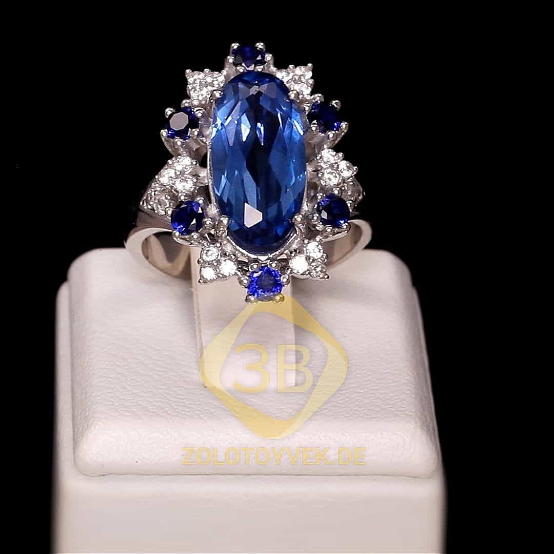 Серебряное кольцо с кварцем london blue и фианитами, покрытие родий