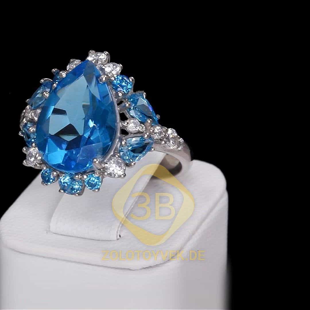 Серебряное кольцо с голубым кварцем и фианитами, покрытие родий