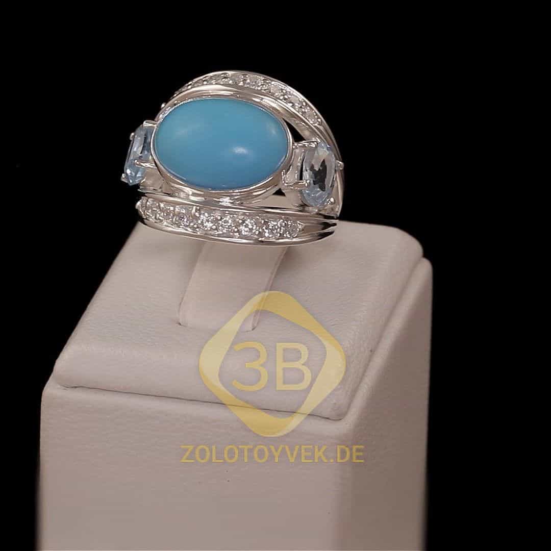 Серебряное кольцо с им. бирюзы, голубым топазом и фианитами, покрытие родий