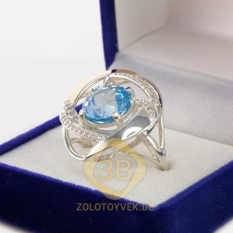 Серебряное кольцо со вставками золота, голубым топазом, фианитами