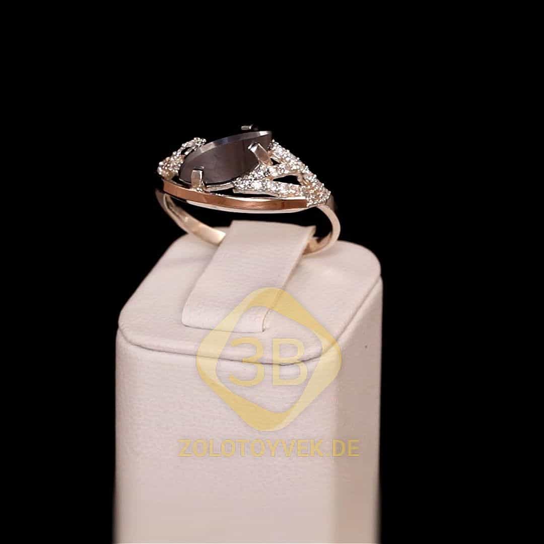Серебряное кольцо со вставками золота, им. гематитом и фианитами