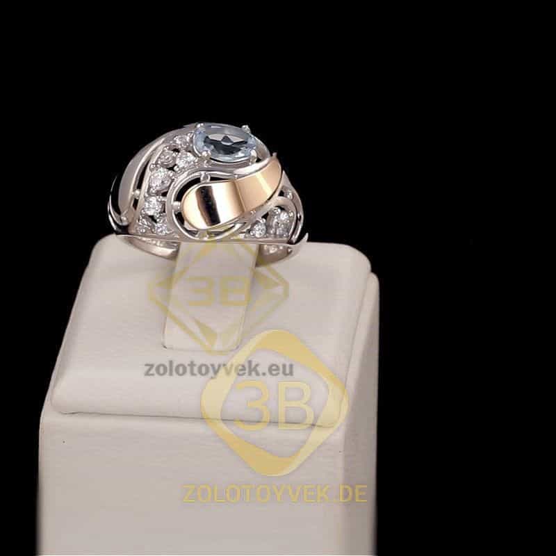 Серебряное  кольцо со вставками золота, голубым топазом и фианитами, покрытие Родий