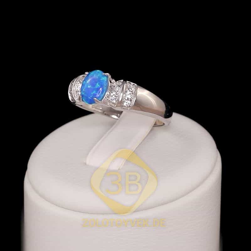 Серебряное кольцо с голубым опалом и фианитами, покрытие Родий