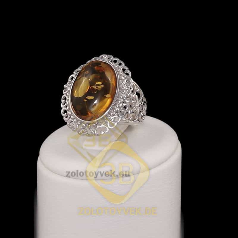 Серебряное кольцо с янтарем , покрытие Родий
