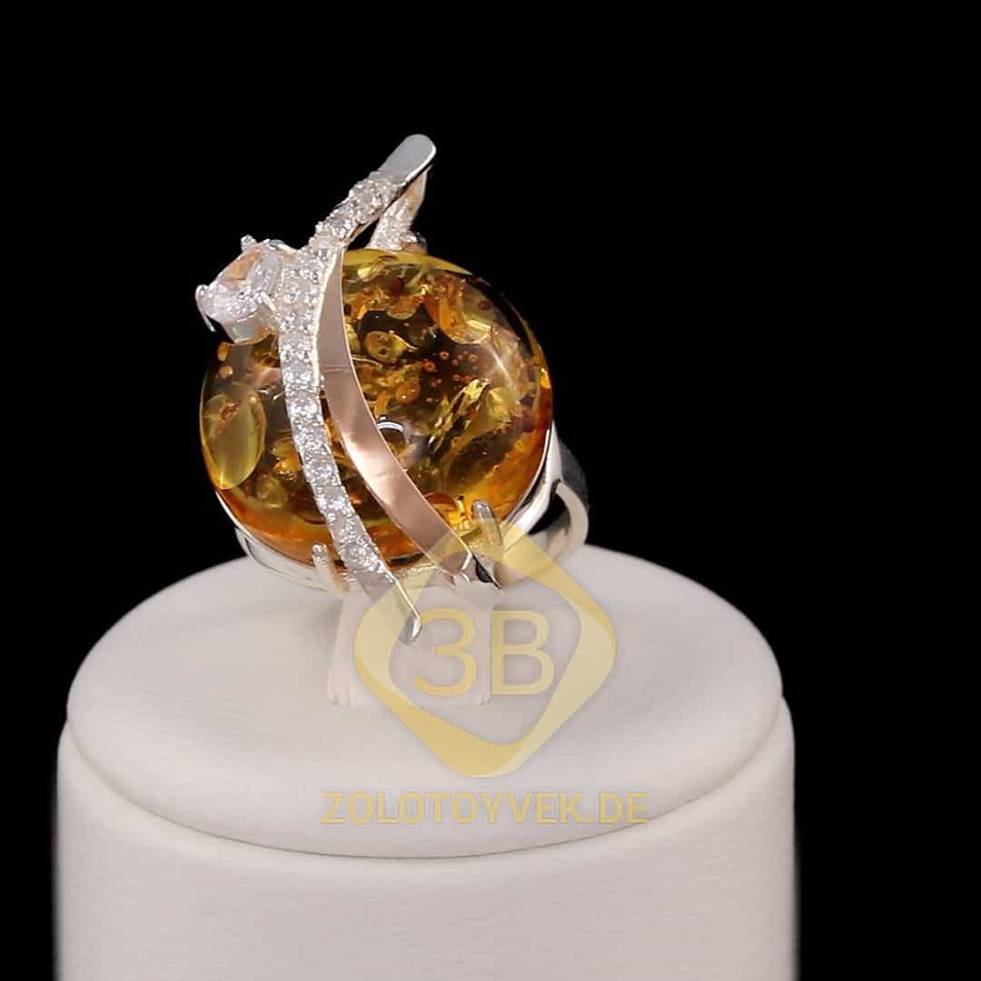 Серебряное кольцо со вставками золота и им. янтаря, покрытие Родий