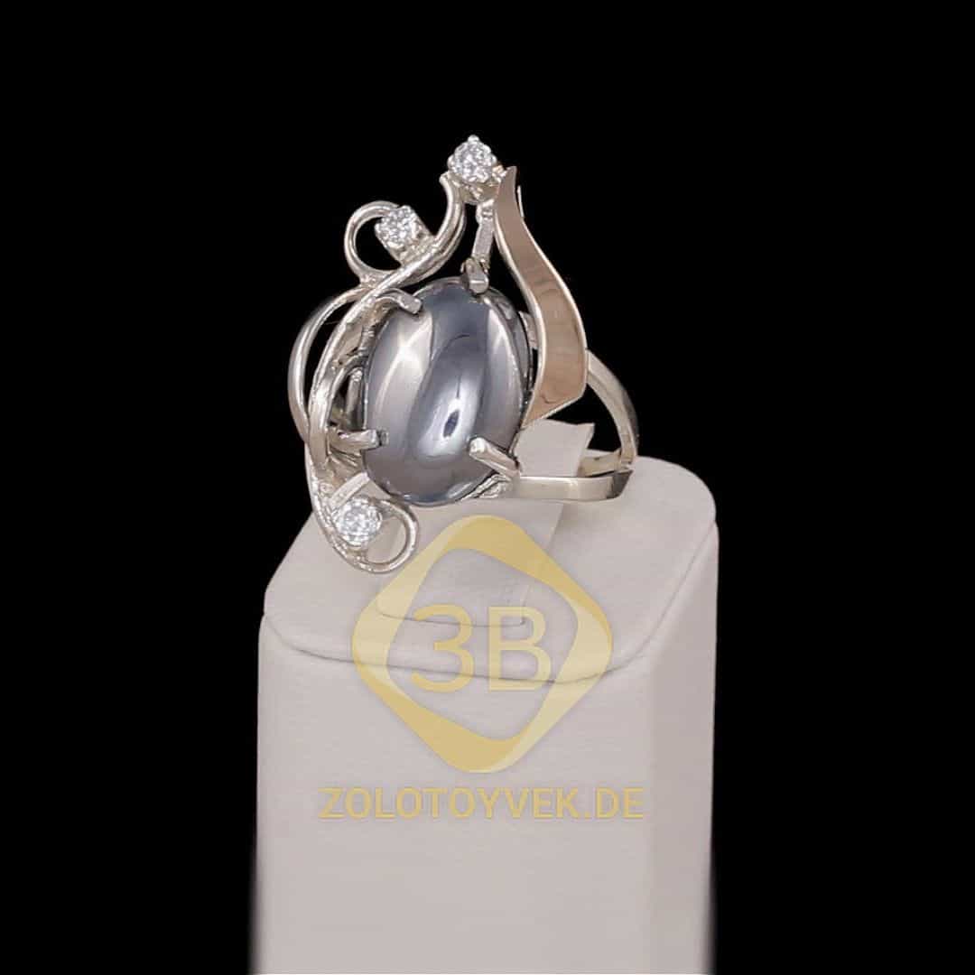 Серебряное кольцо со вставками золота, им. гематитом и фианитами, покрытие Родий