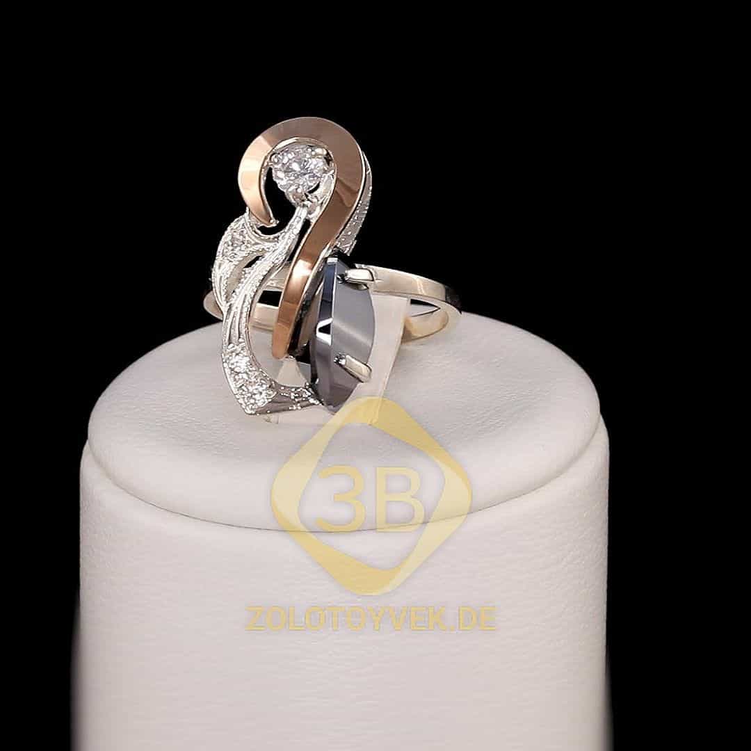 Серебряное кольцо со вставками золота, им. гематитом и фианитами, покрытие Родий