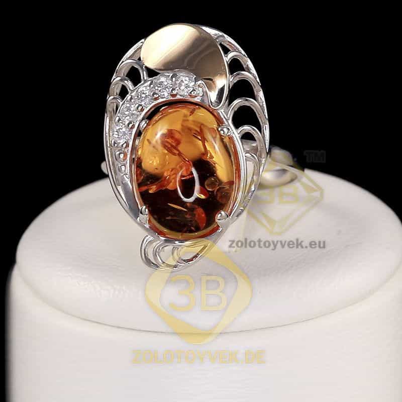 Серебряное кольцо со вставками золота, им. янтаря и фианитами, покрытие Родий