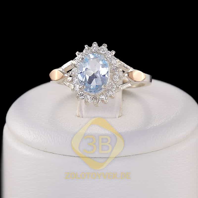 Серебряное кольцо со вставками золота, голубым топазом и фианитами, покрытие Родий