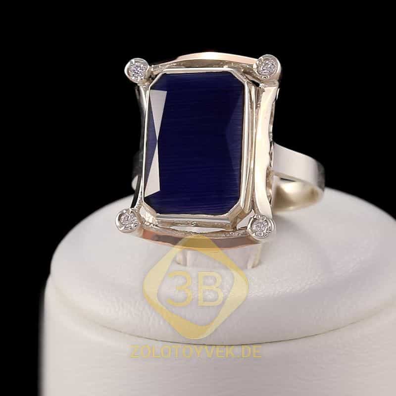 Серебряное кольцо со вставками золота, им. синего улексита и фианитами, покрытие Родий