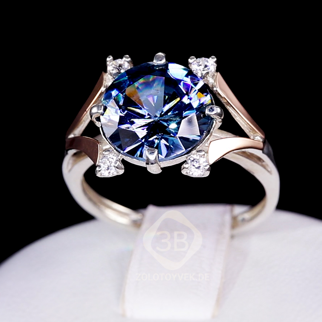 Серебряное кольцо с золотом, топазом London Blue и фианитами