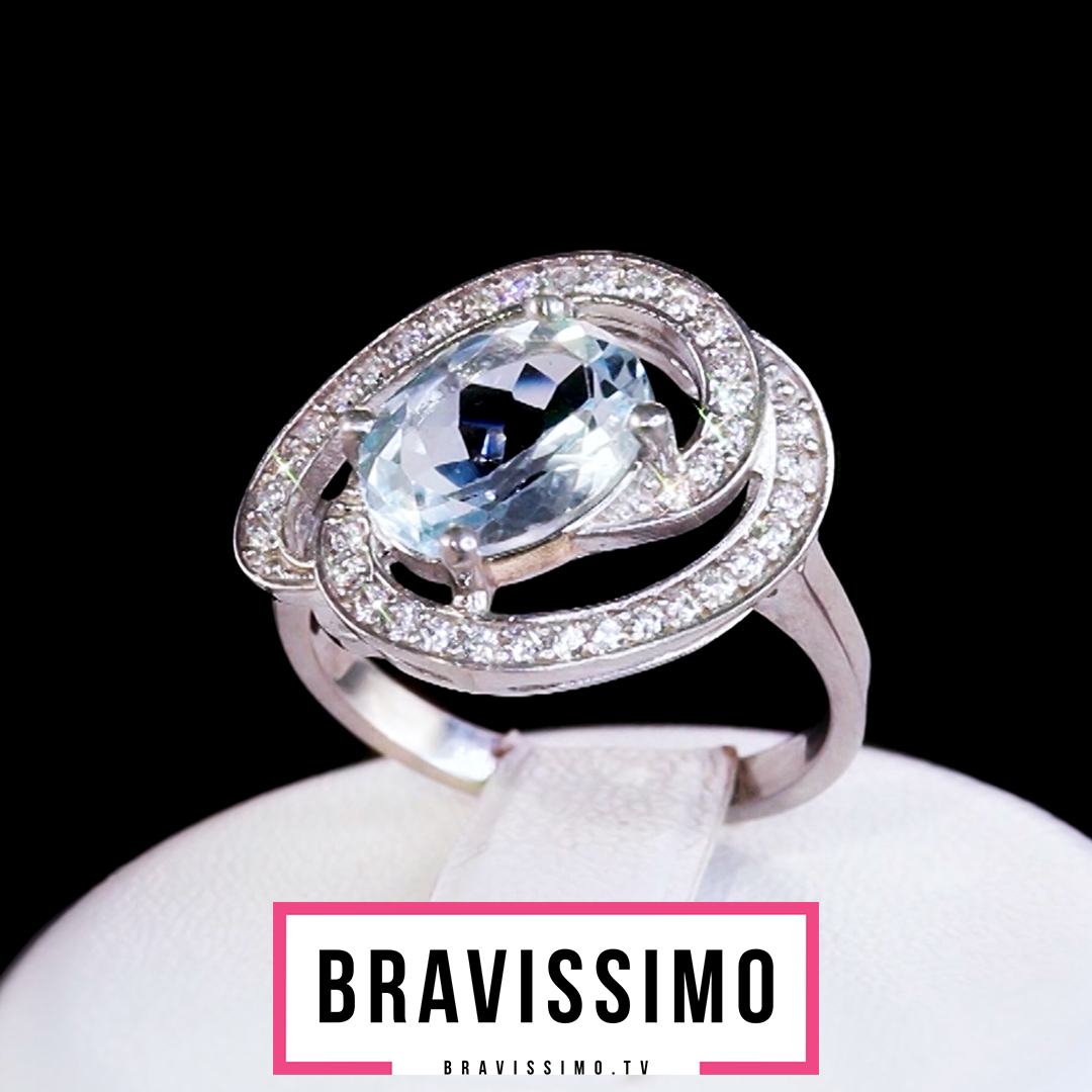 Серебряное кольцо с голубым топазом и цирконами