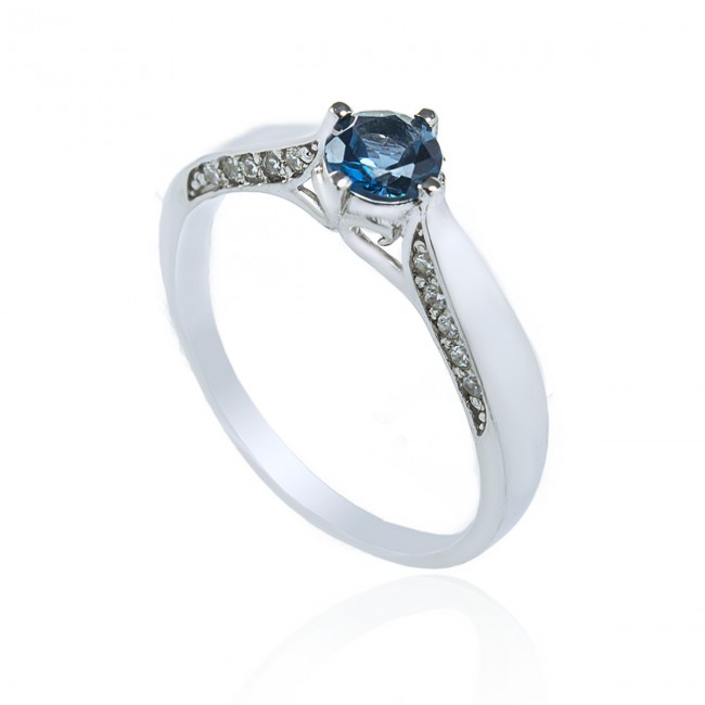 Серебряное кольцо с топазом Swiss blue и цирконами